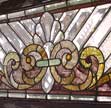 Click to enlarge this detail of the Victorian combination stained, jeweled, and beveled window above.